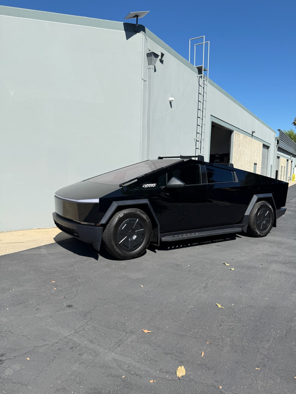 Gloss black Cybertruck in color PPF at TESPLUS