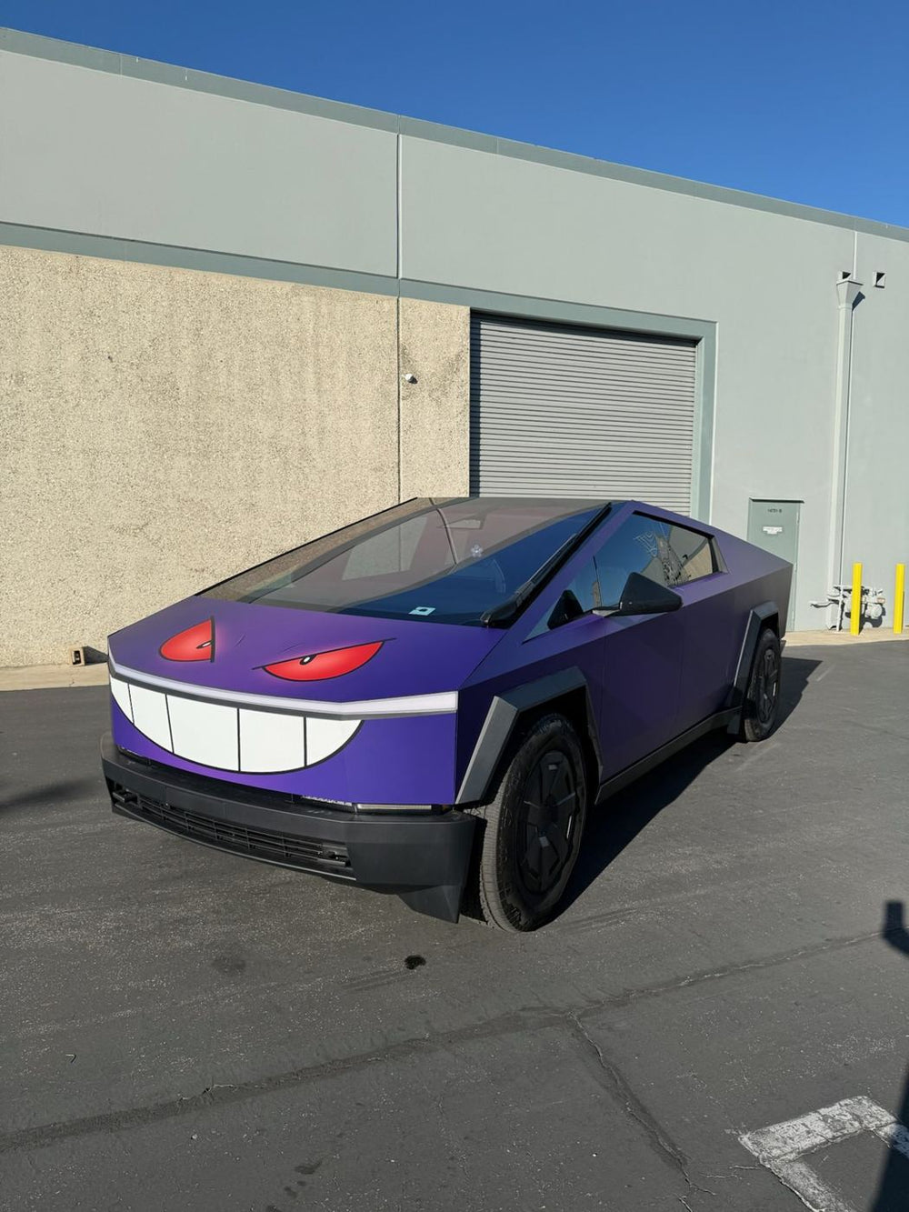 Purple Cybertruck with custom character face graphic