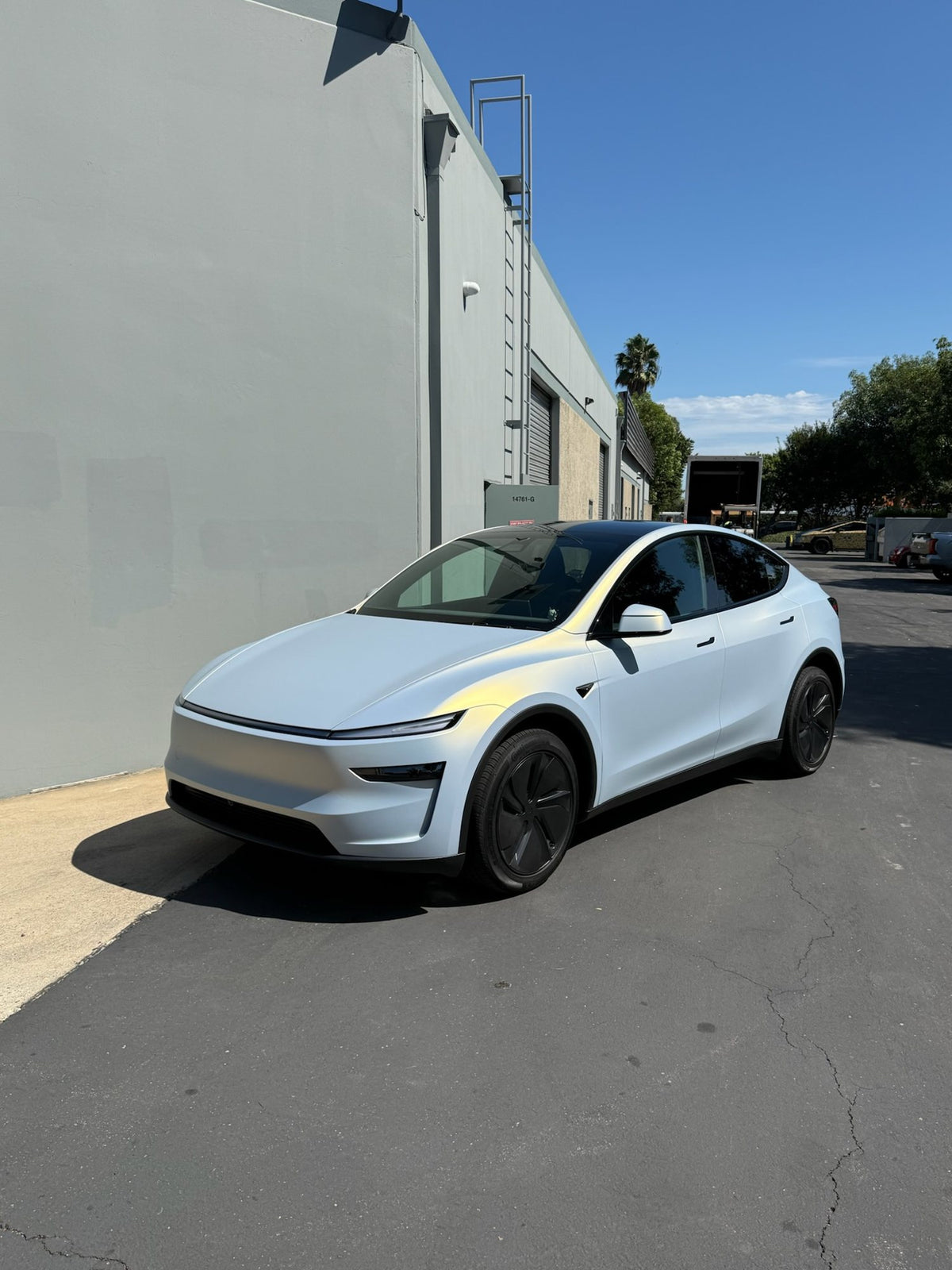 Satin pearl white Model Y in color PPF at the TESPLUS Tustin studio